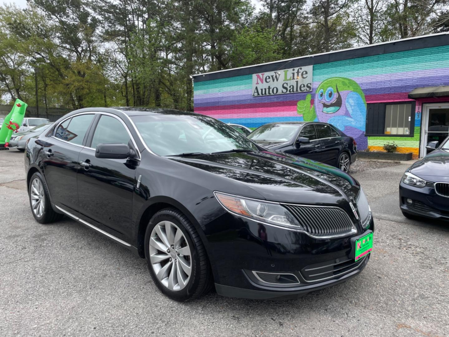 2016 BLACK LINCOLN MKS BASE (1LNHL9DK0GG) with an 3.7L engine, Automatic transmission, located at 5103 Dorchester Rd., Charleston, SC, 29418-5607, (843) 767-1122, 36.245171, -115.228050 - Photo#0